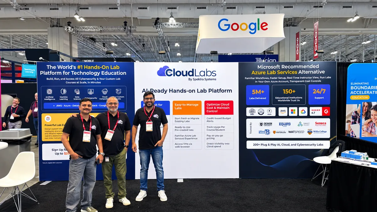 Three CloudLabs team members in front of the stand and its AI-Ready Hands-on Lab Platform banners at EDUCAUSE 2025